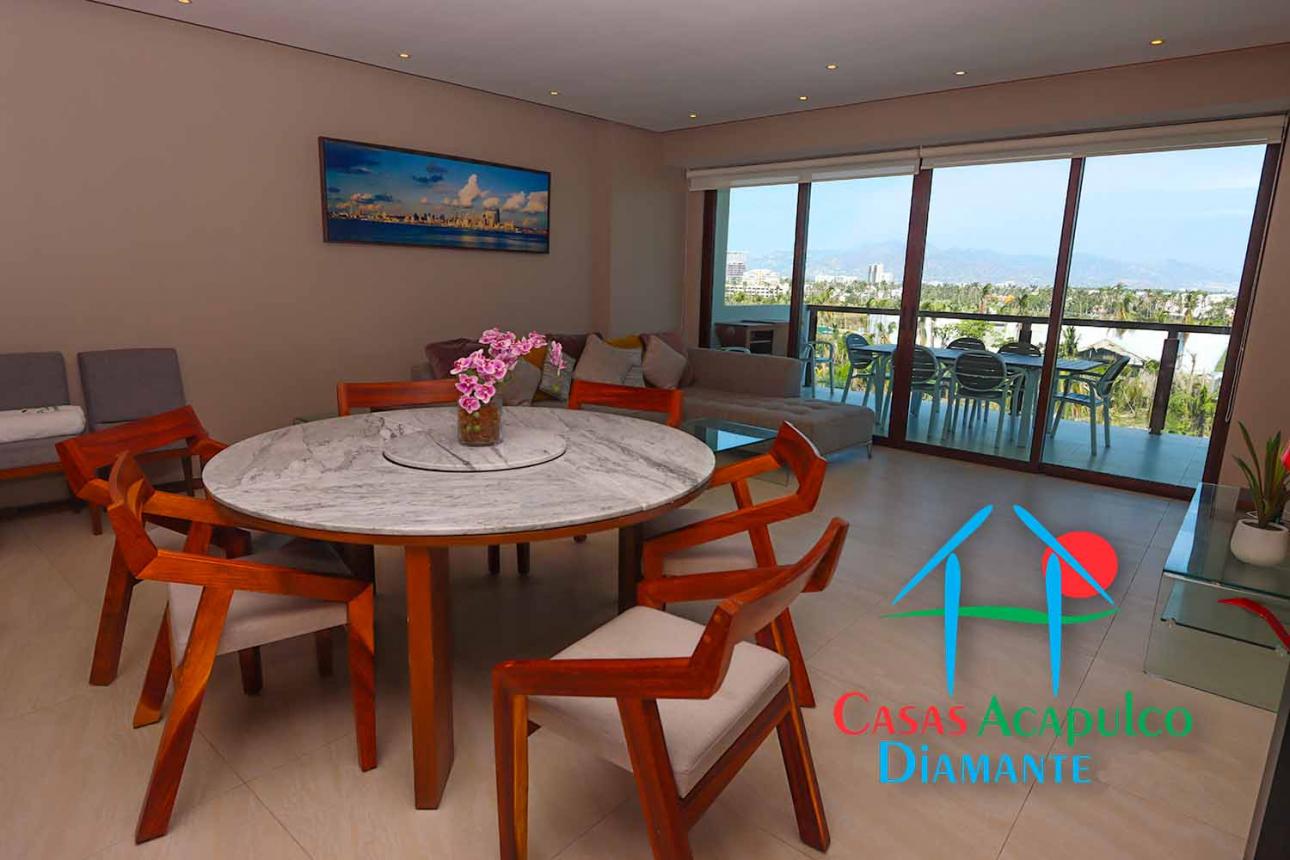 Departamento de playa con terraza y vista a las albercas